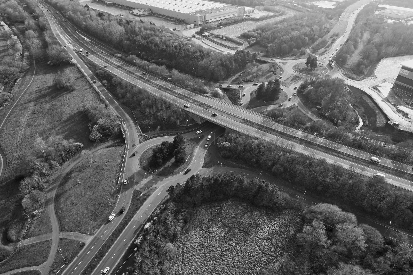 Aerial view of UK road networks connecting towns and motorways