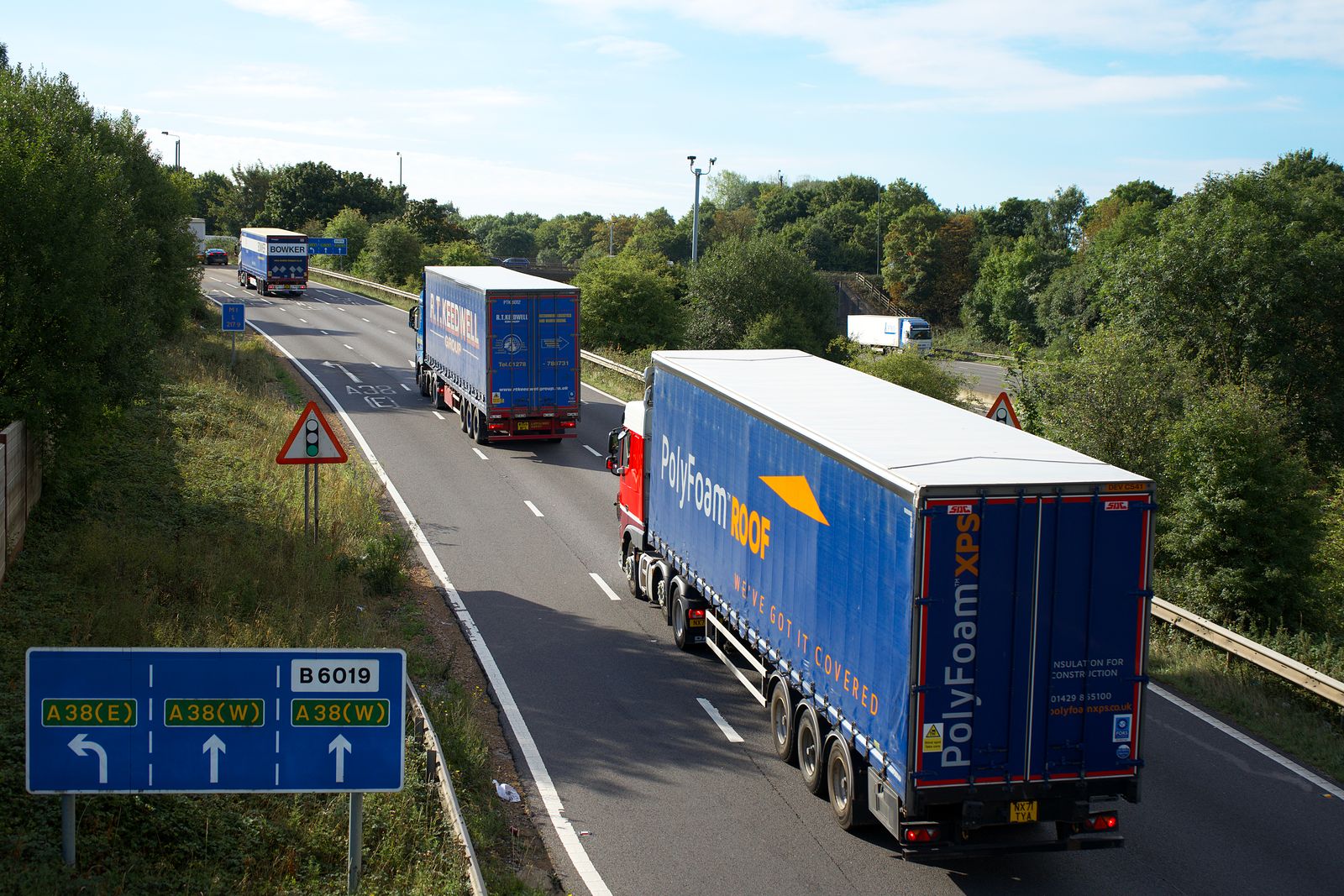 Fleet of trucks moving on a UK motorway