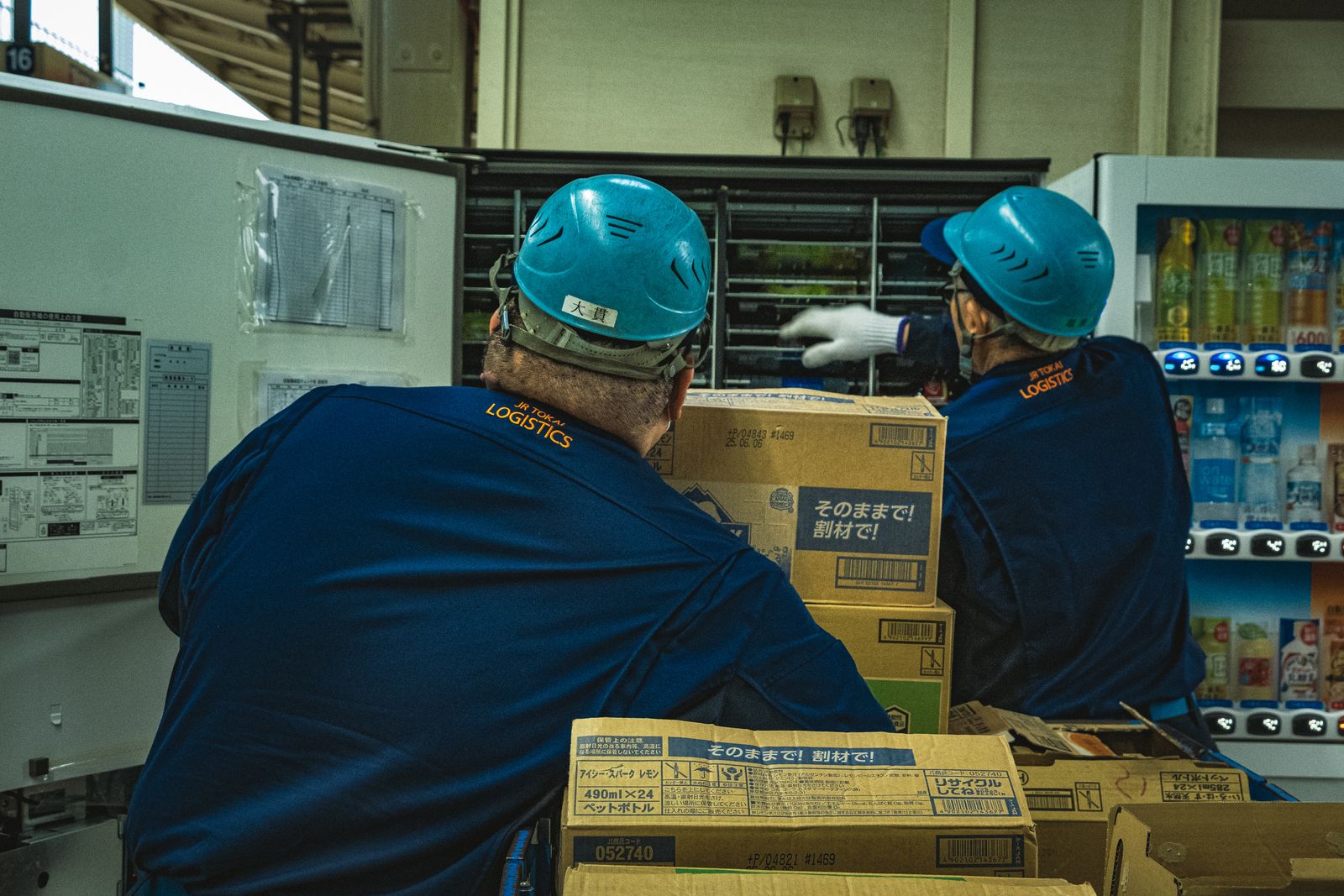 Warehouse workers handling logistics boxes