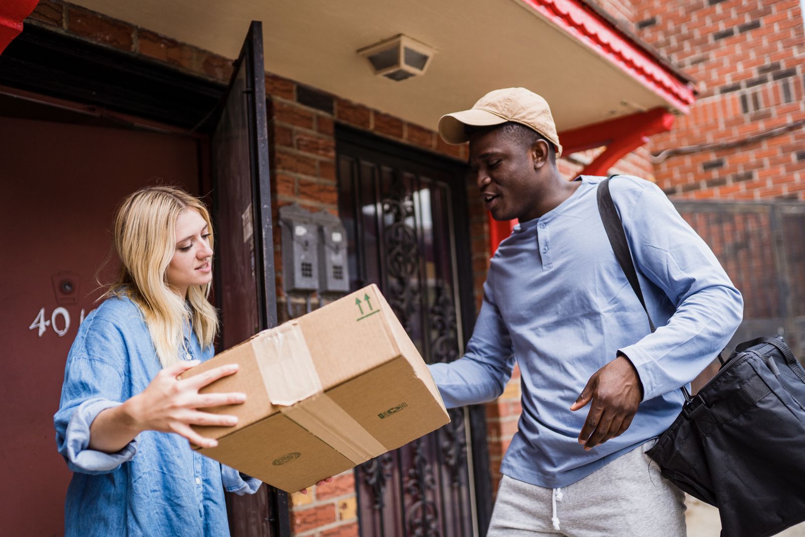 Courier delivering a package to a customer's doorstep