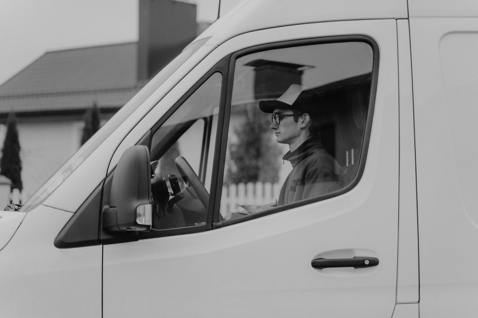 Delivery driver behind the wheel of a van