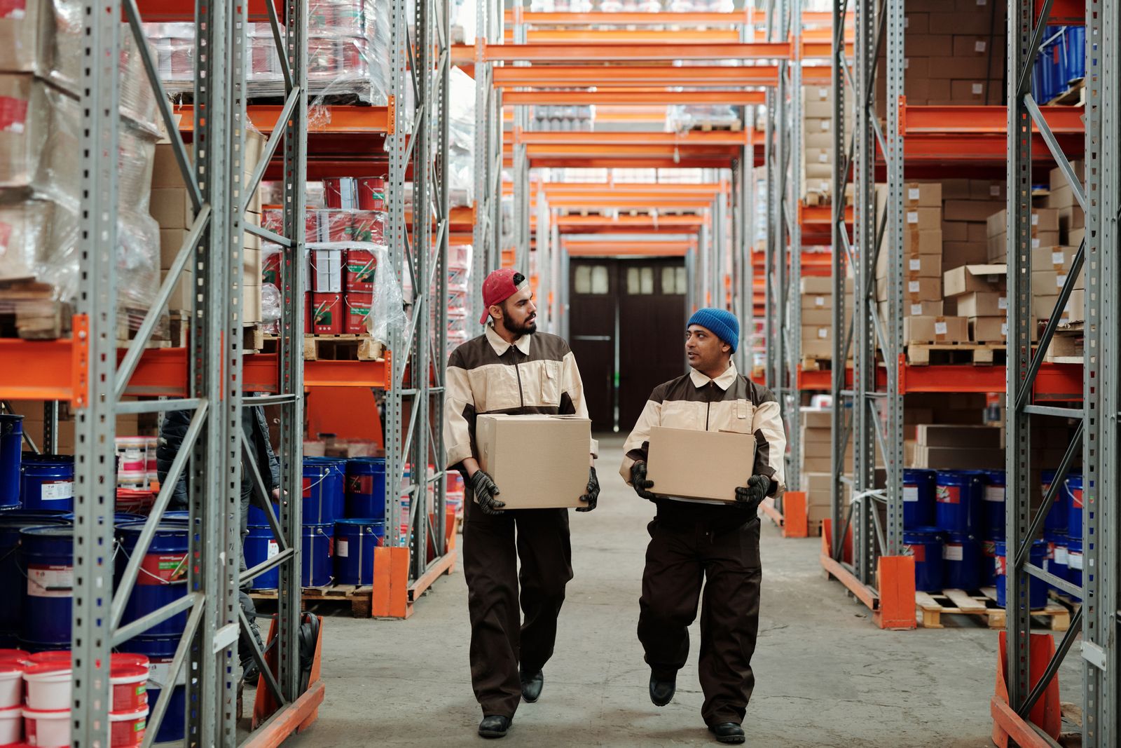Warehouse workers carrying boxes for fulfilment centre delivery